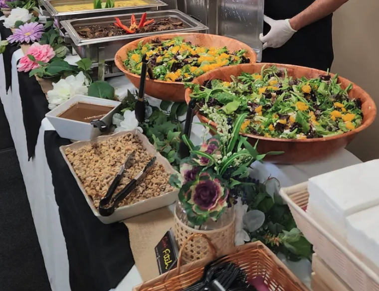 Catering buffet with fresh salads and sides
